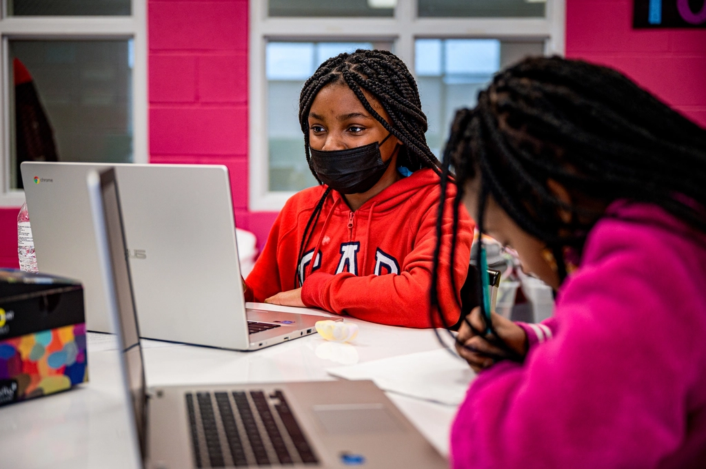 Students learning on laptops