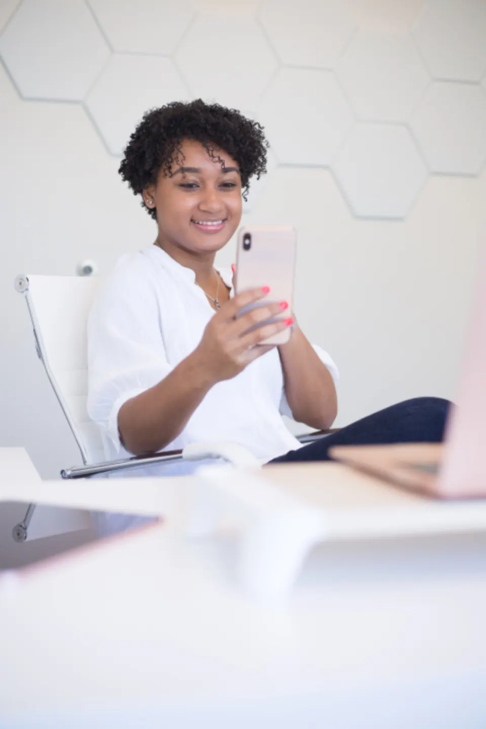 Business owner checking bookings on her phone